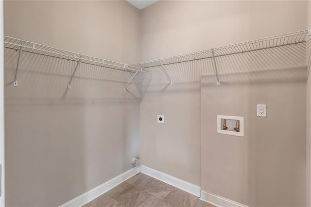 laundry room featuring hookup for a washing machine, laundry area, hookup for an electric dryer, and baseboards