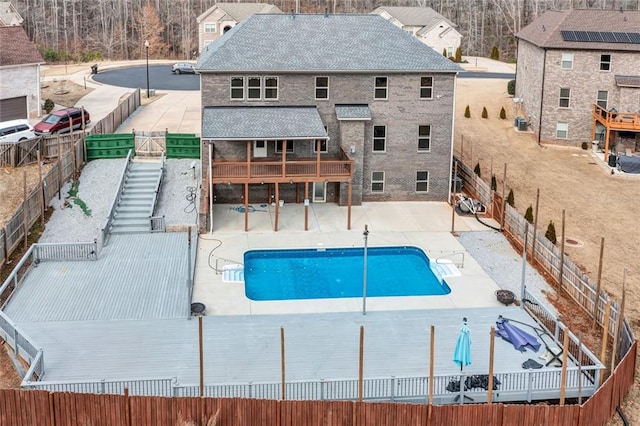 view of pool featuring a patio, a fenced backyard, and a fenced in pool