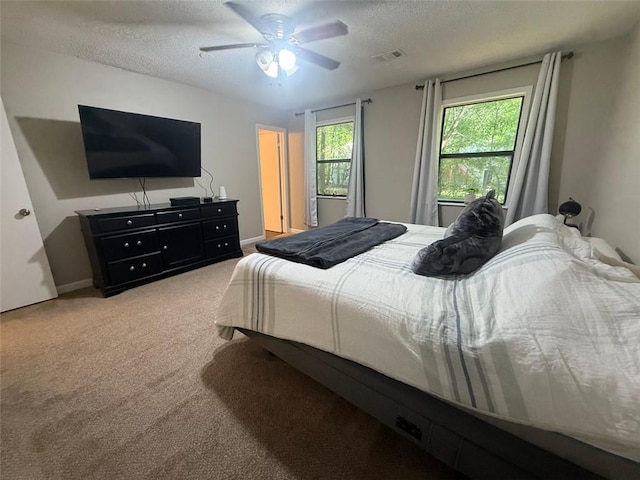2661 Throatlatch Ln SW, Marietta, GA 30064 - bedroom featuring a textured ceiling, light colored carpet, and a ceiling fan