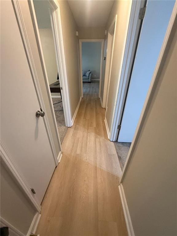 2661 Throatlatch Ln SW, Marietta, GA 30064 - corridor featuring light wood-style flooring and baseboards
