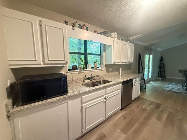 2661 Throatlatch Ln SW, Marietta, GA 30064 - kitchen with stainless steel dishwasher, a sink, black microwave, white cabinets, and a textured ceiling