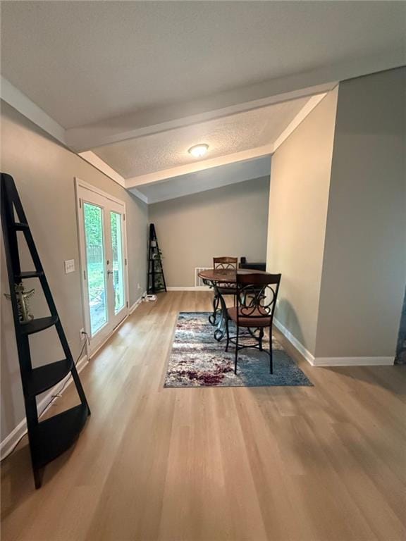 2661 Throatlatch Ln SW, Marietta, GA 30064 - dining space featuring wood finished floors, baseboards, and beamed ceiling