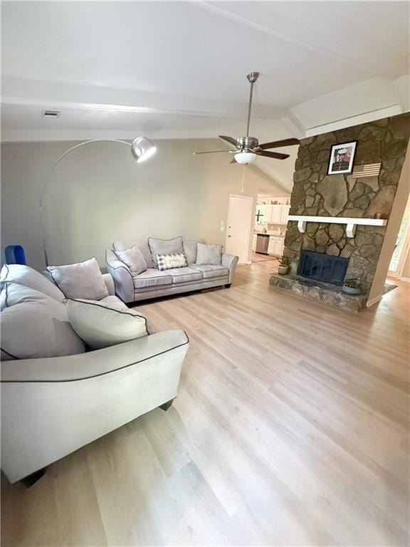 2661 Throatlatch Ln SW, Marietta, GA 30064 - living room featuring wood finished floors, ceiling fan, and a stone fireplace