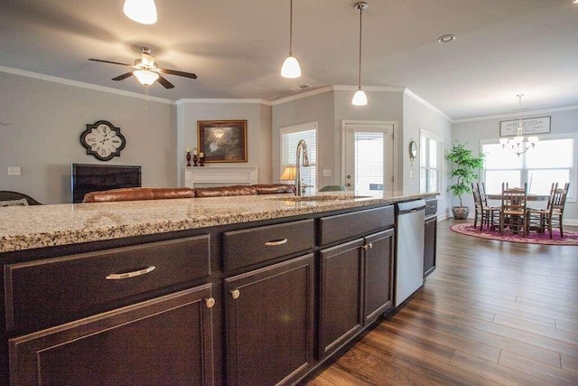 kitchen with dishwasher, light stone countertops, dark brown cabinets, dark wood-type flooring, and sink