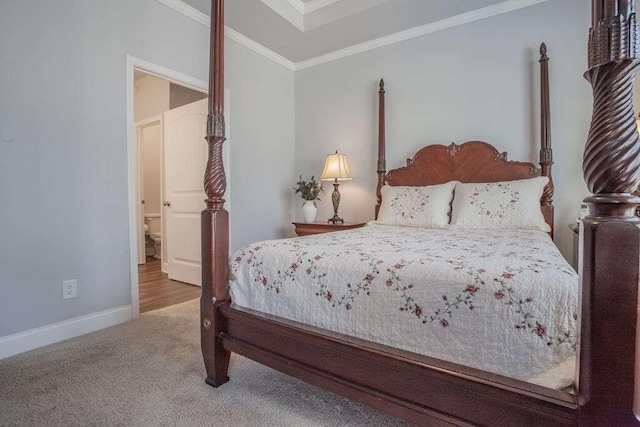 carpeted bedroom featuring crown molding