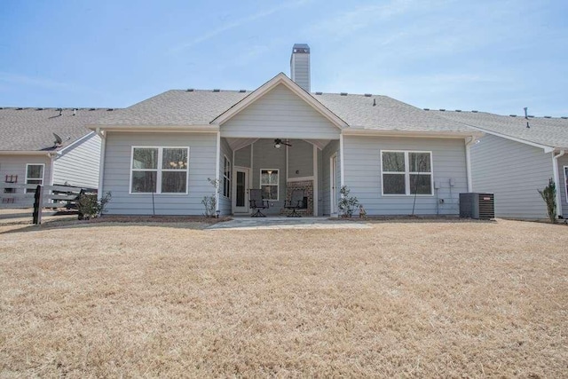 back of property featuring a patio, central air condition unit, a lawn, and ceiling fan