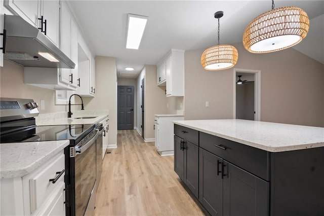 kitchen with white cabinetry, sink, ceiling fan, hanging light fixtures, and stainless steel range with electric stovetop