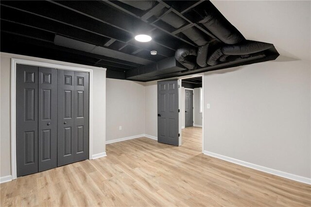 basement featuring light hardwood / wood-style flooring