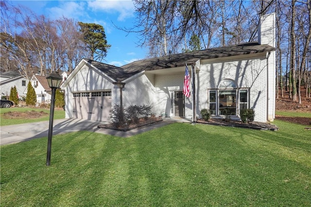 view of front of property with a front yard and a garage