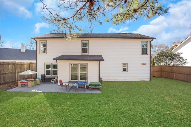 back of property featuring a patio and a lawn