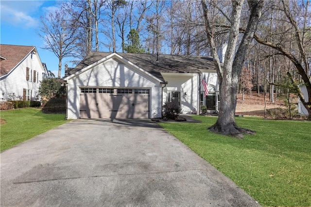 view of property exterior with a yard and a garage