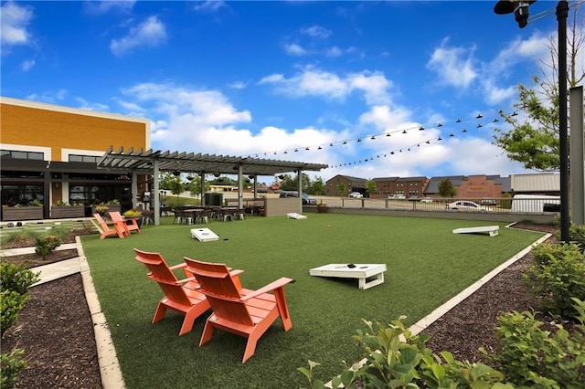 view of community featuring a lawn and a pergola