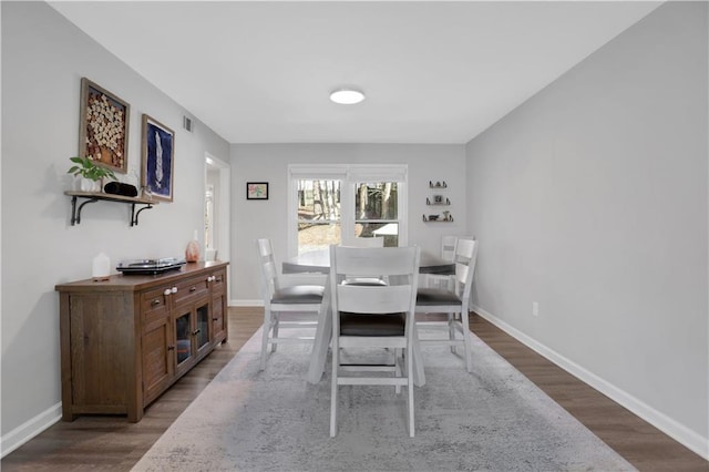 dining space featuring hardwood / wood-style floors