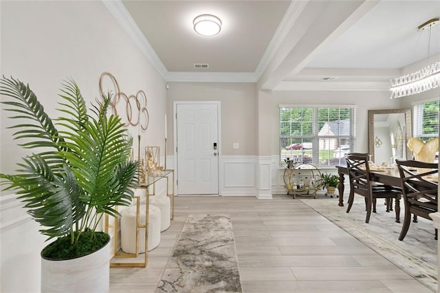 140 Canyons Ct, Hampton, GA 30228 - foyer entrance featuring crown molding, light wood-style flooring, and wainscoting