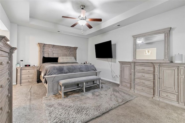 140 Canyons Ct, Hampton, GA 30228 - carpeted bedroom with a raised ceiling and a ceiling fan