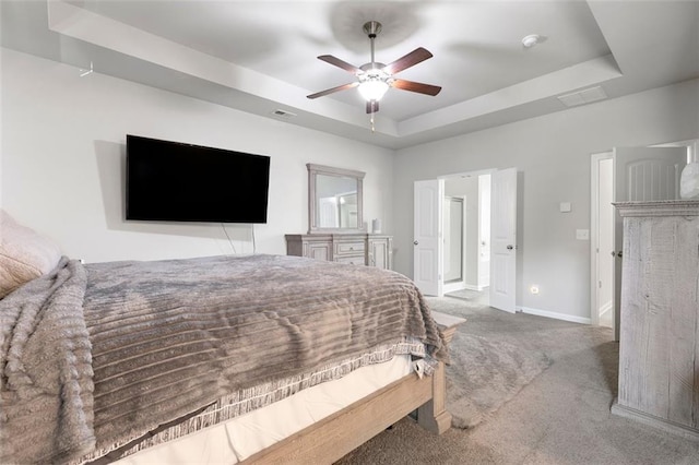 140 Canyons Ct, Hampton, GA 30228 - carpeted bedroom with a raised ceiling and ceiling fan