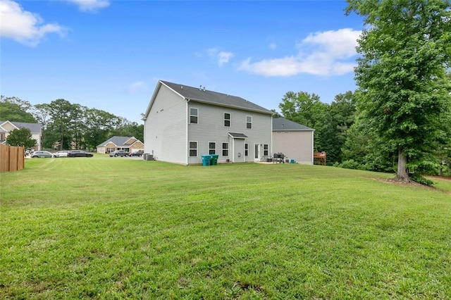 140 Canyons Ct, Hampton, GA 30228 - back of house featuring a yard