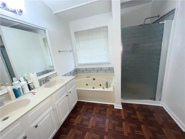 full bathroom with double vanity, a stall shower, a sink, and a jetted tub