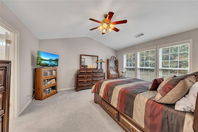 bedroom with baseboards, visible vents, a ceiling fan, light colored carpet, and lofted ceiling