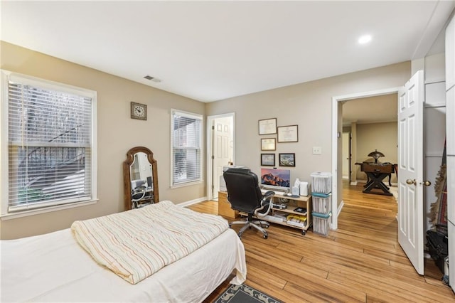 bedroom with light wood-type flooring