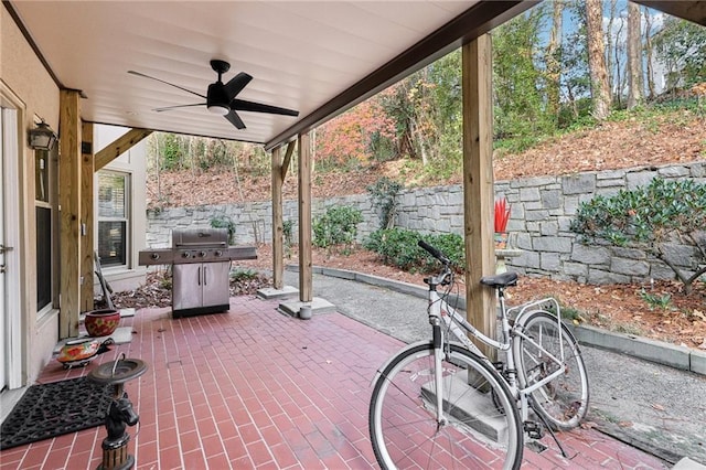 view of patio / terrace with ceiling fan and a grill