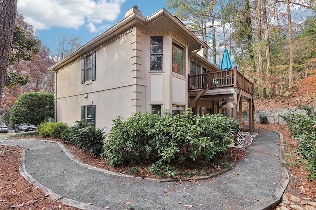 view of side of property featuring a deck