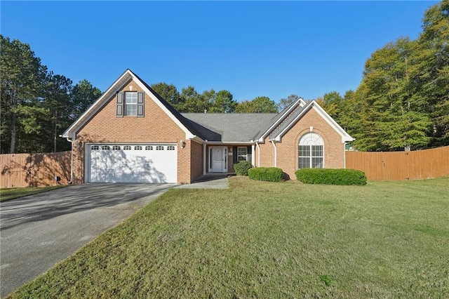 view of front property with a front lawn and a garage