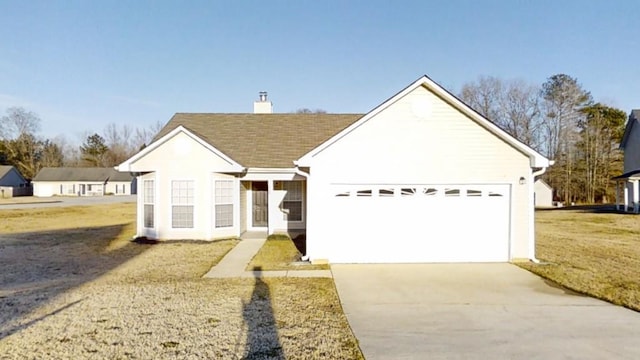 ranch-style house with a garage and a front lawn