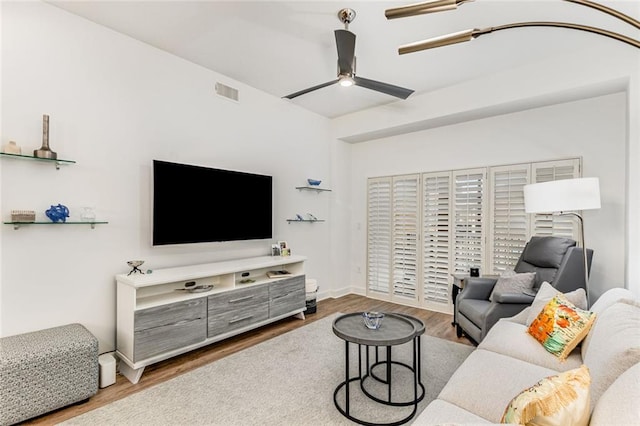 200 River Vista Dr Unit 713, Atlanta, GA 30339 - living room featuring visible vents, a ceiling fan, and wood finished floors