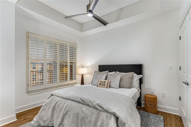 200 River Vista Dr Unit 713, Atlanta, GA 30339 - bedroom featuring ceiling fan, baseboards, and wood finished floors