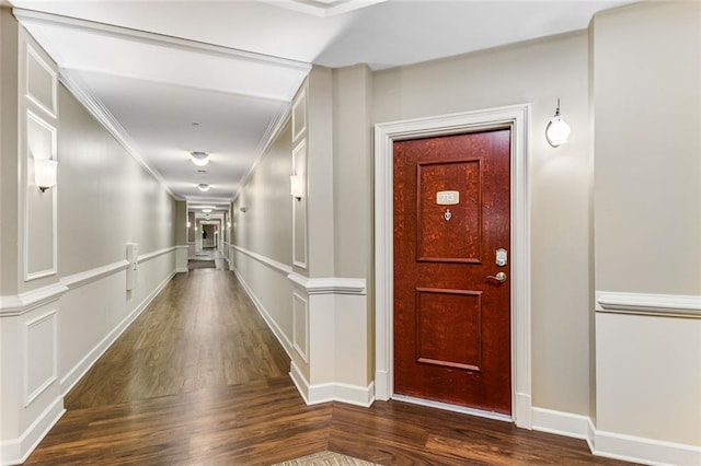 200 River Vista Dr Unit 713, Atlanta, GA 30339 - hall with crown molding, a decorative wall, and wood finished floors
