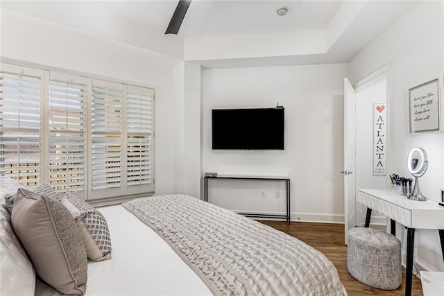 200 River Vista Dr Unit 713, Atlanta, GA 30339 - bedroom with ceiling fan, multiple windows, baseboards, and wood finished floors