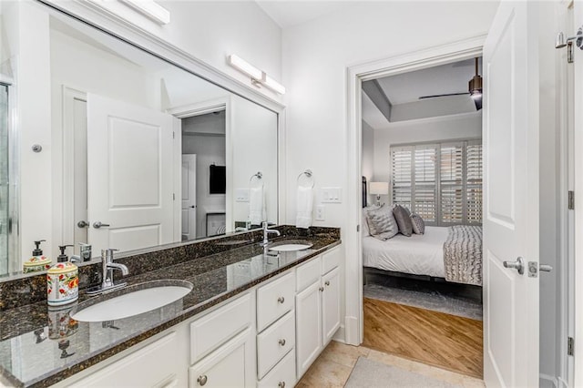 200 River Vista Dr Unit 713, Atlanta, GA 30339 - ensuite bathroom featuring wood finished floors, double vanity, a sink, and connected bathroom