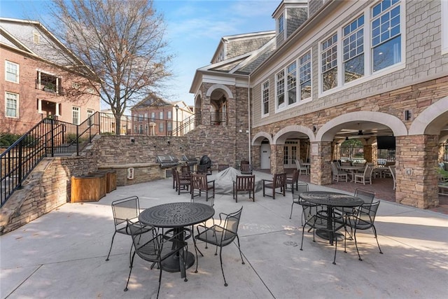 200 River Vista Dr Unit 713, Atlanta, GA 30339 - view of patio / terrace with outdoor dining space, a grill, and area for grilling