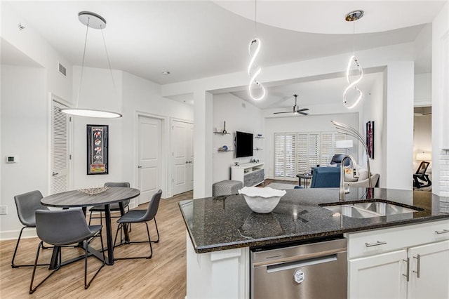 200 River Vista Dr Unit 713, Atlanta, GA 30339 - kitchen featuring visible vents, dishwasher, a sink, a ceiling fan, and light wood-style floors