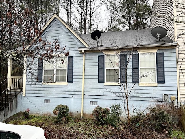 view of side of property featuring central air condition unit