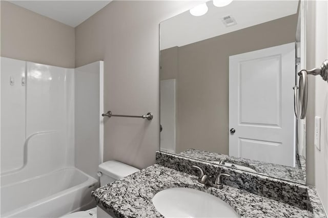 bathroom featuring bathtub / shower combination, visible vents, vanity, and toilet