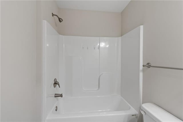 full bathroom featuring tub / shower combination and toilet