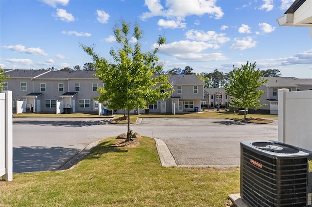 view of street with a residential view and curbs