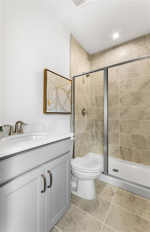 4317 Azalea Ridge Way, Hoschton, GA 30548 - bathroom with a stall shower, vanity, and tile patterned flooring