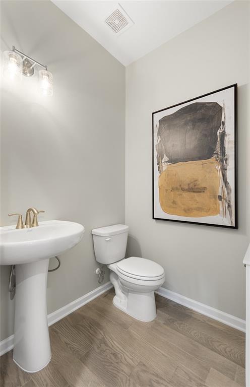 4317 Azalea Ridge Way, Hoschton, GA 30548 - bathroom featuring wood finished floors
