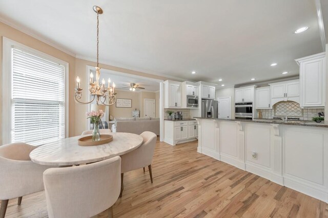 4621 Chartwell Chase Ct, Flowery Branch, GA 30542 - dining room featuring a chandelier, light wood-style floors, crown molding, and recessed lighting