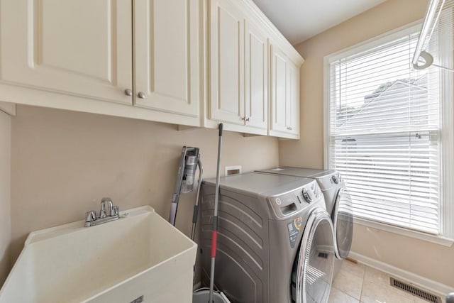 4621 Chartwell Chase Ct, Flowery Branch, GA 30542 - laundry area featuring cabinet space, washing machine and clothes dryer, light tile patterned floors, and baseboards
