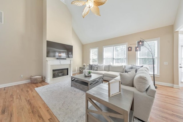 4621 Chartwell Chase Ct, Flowery Branch, GA 30542 - living area featuring a ceiling fan, light wood-style floors, baseboards, and high vaulted ceiling