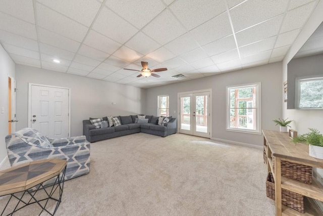 4621 Chartwell Chase Ct, Flowery Branch, GA 30542 - carpeted living room featuring a ceiling fan, french doors, a drop ceiling, and baseboards