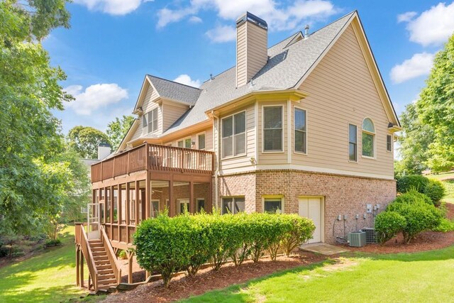 4621 Chartwell Chase Ct, Flowery Branch, GA 30542 - rear view of property with brick siding, a yard, stairs, a chimney, and a balcony