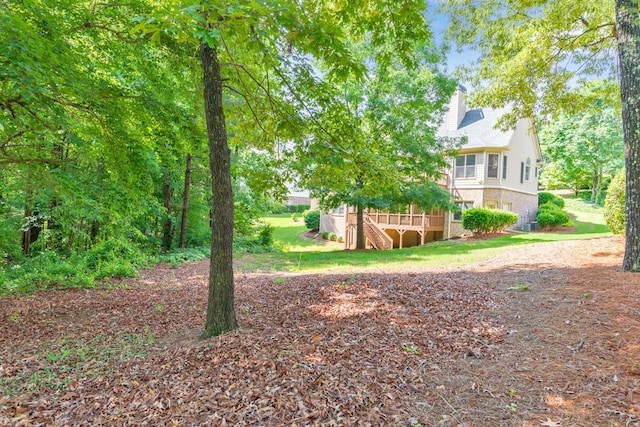 4621 Chartwell Chase Ct, Flowery Branch, GA 30542 - view of yard with stairs and a wooden deck