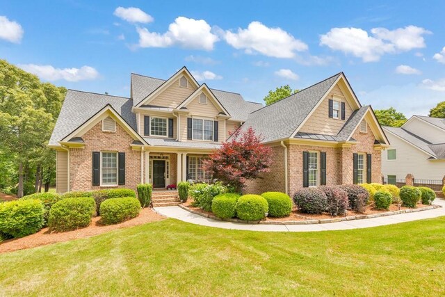 4621 Chartwell Chase Ct, Flowery Branch, GA 30542 - craftsman-style house featuring brick siding, a front lawn, and a shingled roof