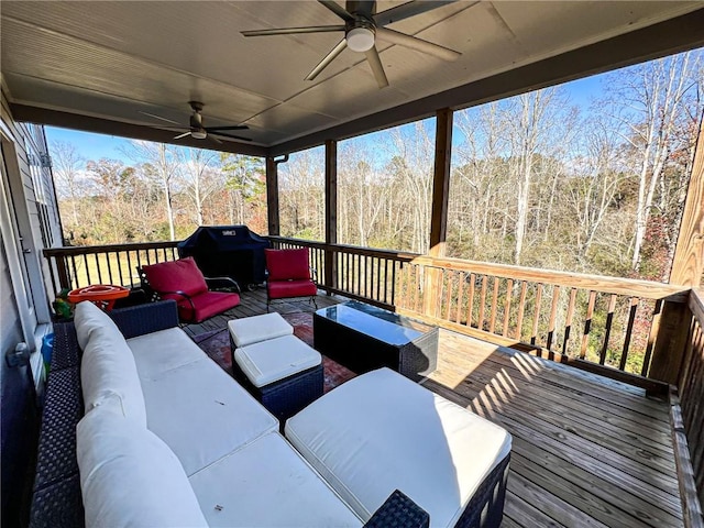 deck featuring grilling area, an outdoor living space, and ceiling fan