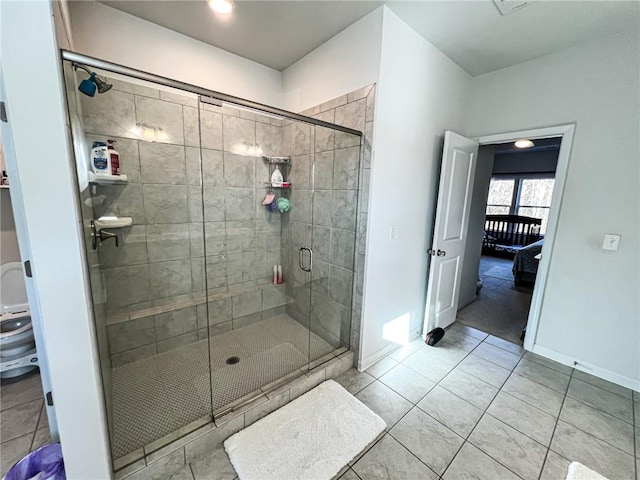 bathroom featuring tile patterned floors and a shower with door